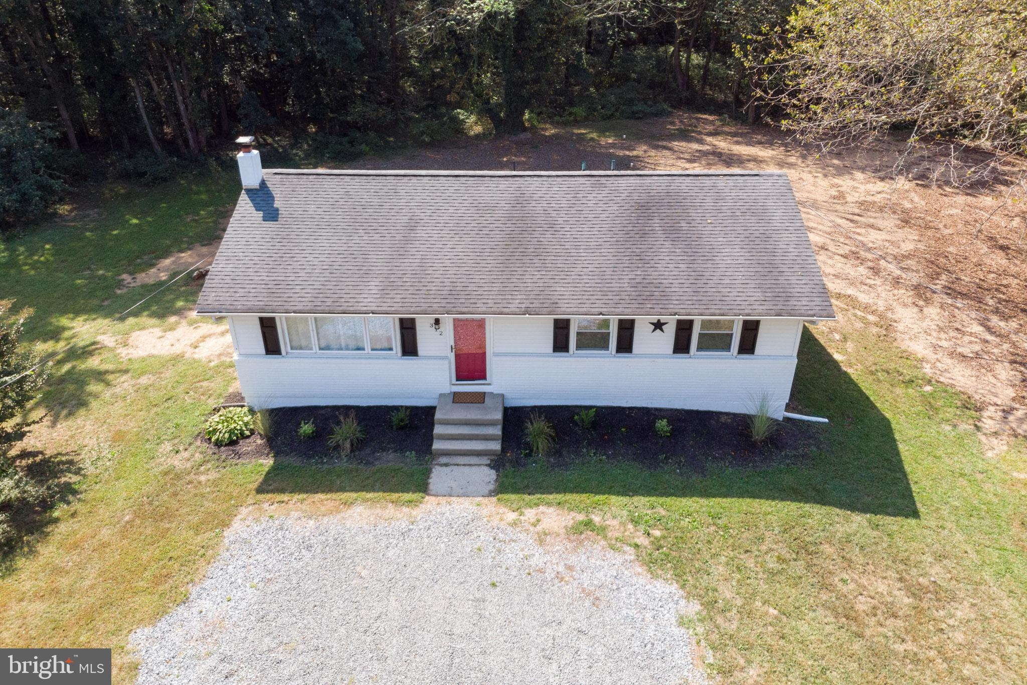 312 Fenwick Road Pilesgrove, NJ 08098 - Photo 36 of 40 front view of a house with a yard