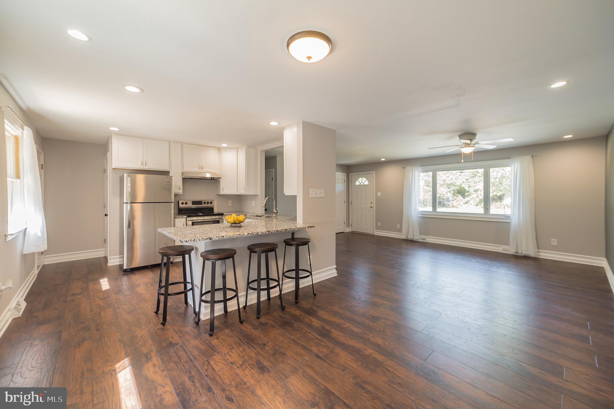 312 Fenwick Road Pilesgrove, NJ 08098 - Photo 7 of 40 a view of a kitchen with dining table and chairs