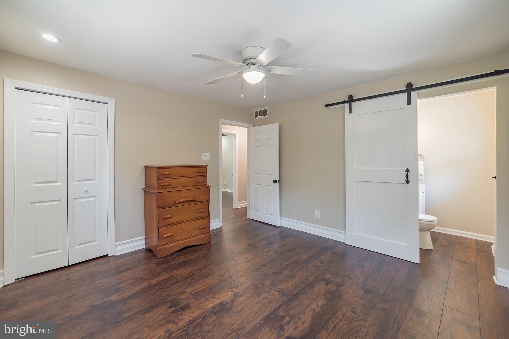 312 Fenwick Road Pilesgrove, NJ 08098 - Photo 9 of 40 an empty room with wooden floor closet and windows