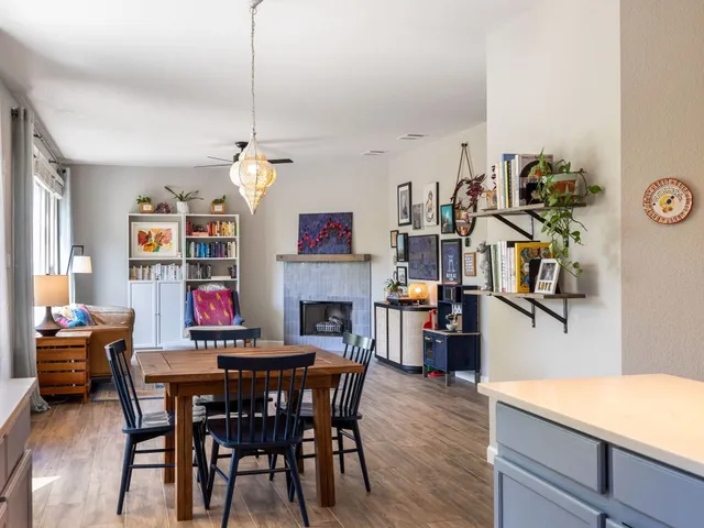 a dining room with furniture and wooden floor