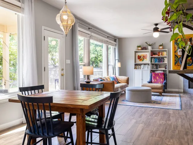 a view of a dining room with furniture window and outside view
