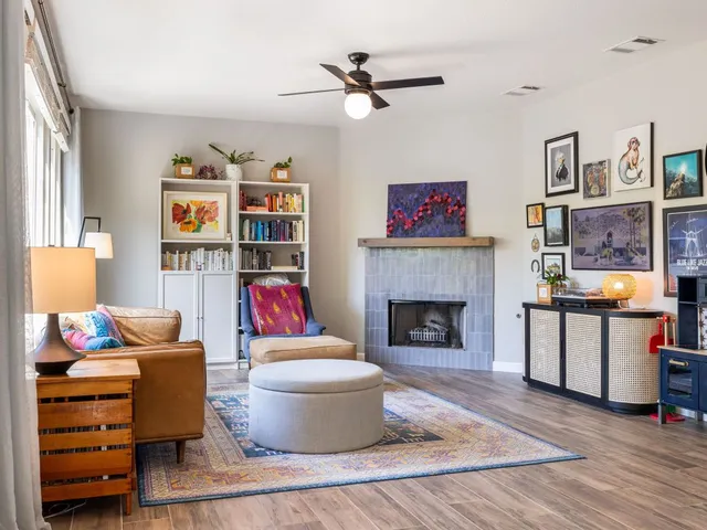 a living room with furniture and a fireplace