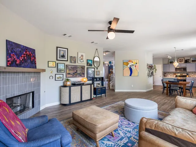 a living room with furniture and a fireplace
