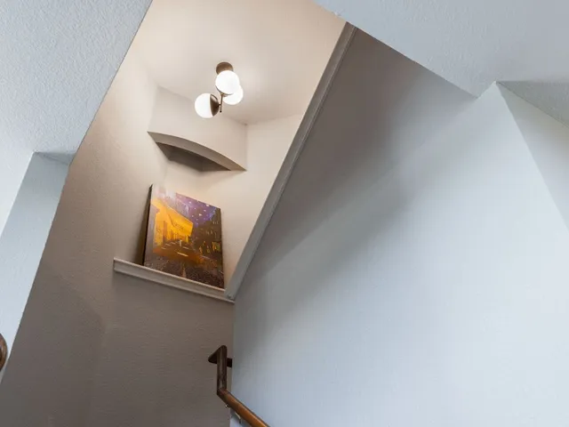 a view of a hallway with a chandelier