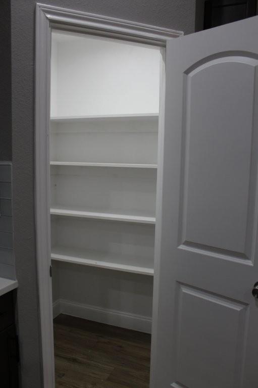 125 Chapperall Drive Mabank, TX 75156 - Photo 9 of 11 a view of walk in closet with empty racks