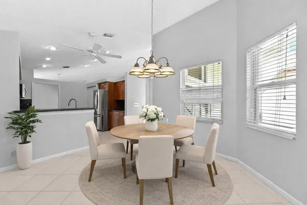 a kitchen with stainless steel appliances granite countertop a stove microwave and sink