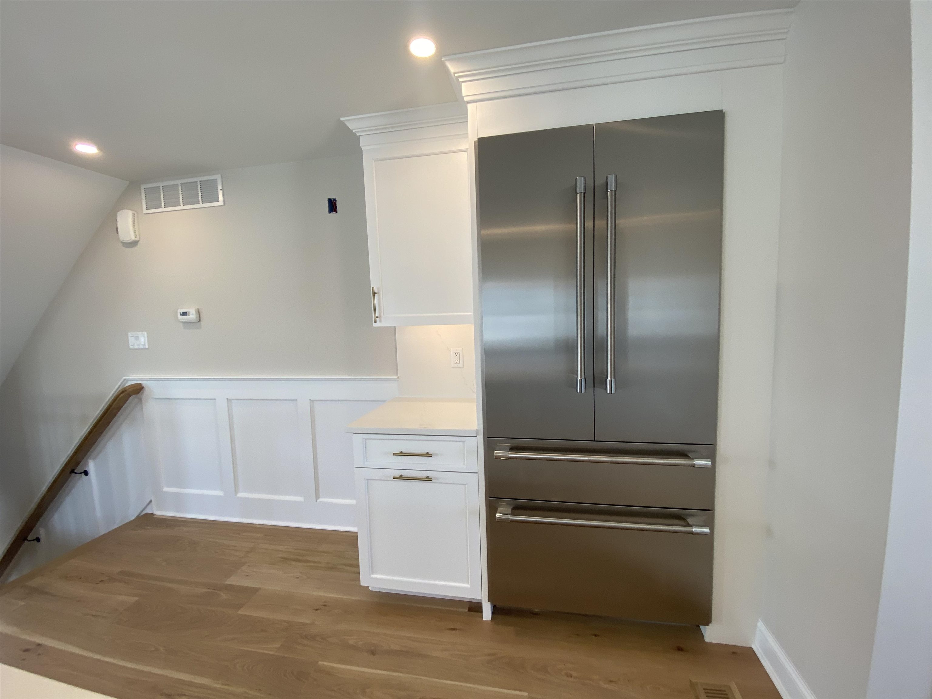 2425 Harbor, Unit 2425 Avalon, NJ 08202 - Photo 21 of 46 a kitchen with white cabinets and refrigerator