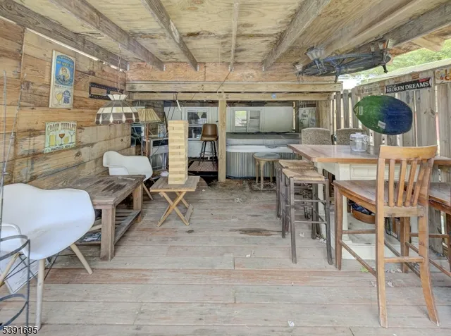 a view of a chairs and table in a patio