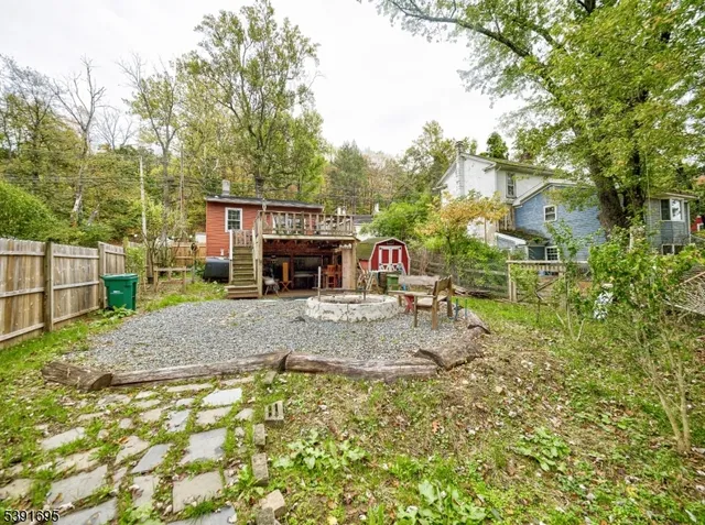 a view of a yard with large tree