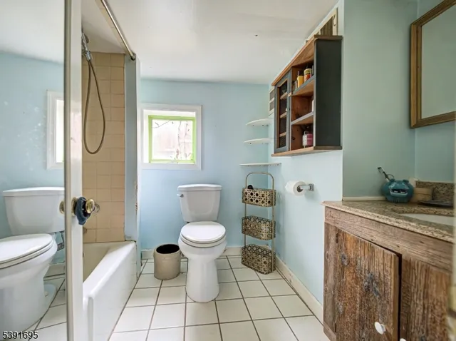 a bathroom with a sink a toilet and a bathtub