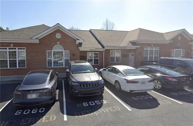 a front view of house with yard outdoor seating and barbeque oven