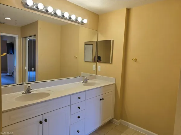 a bathroom with a toilet a sink and shower