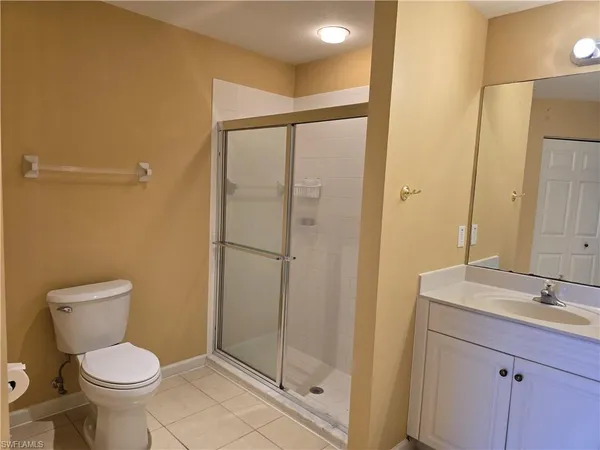 a view of a livingroom with an empty space and a window