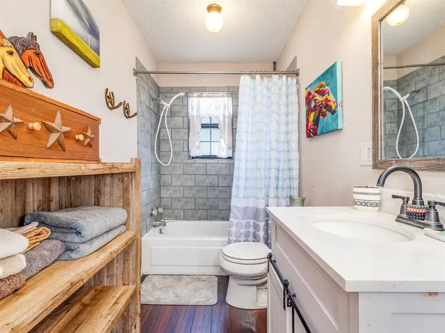 a bathroom with a sink a toilet and a bathtub