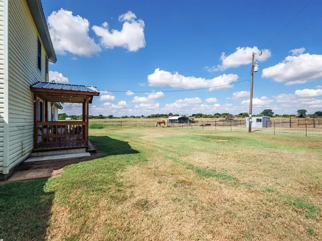 a view of a lake with a big yard