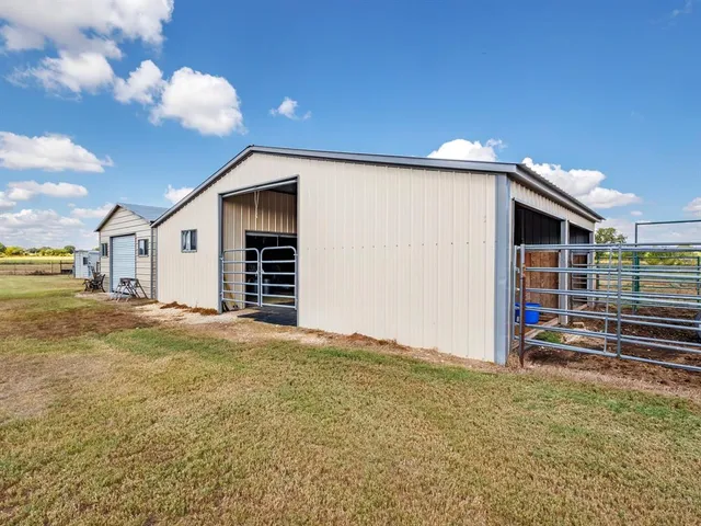 a view of a house with backyard and entertaining space