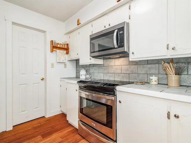 a kitchen with a stove and a microwave