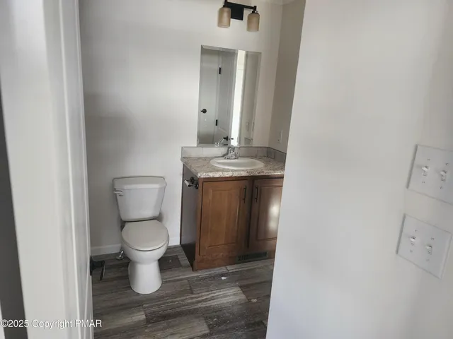 a view of bathroom with a sink and a toilet