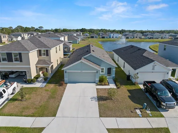 an aerial view of a house with a lake view