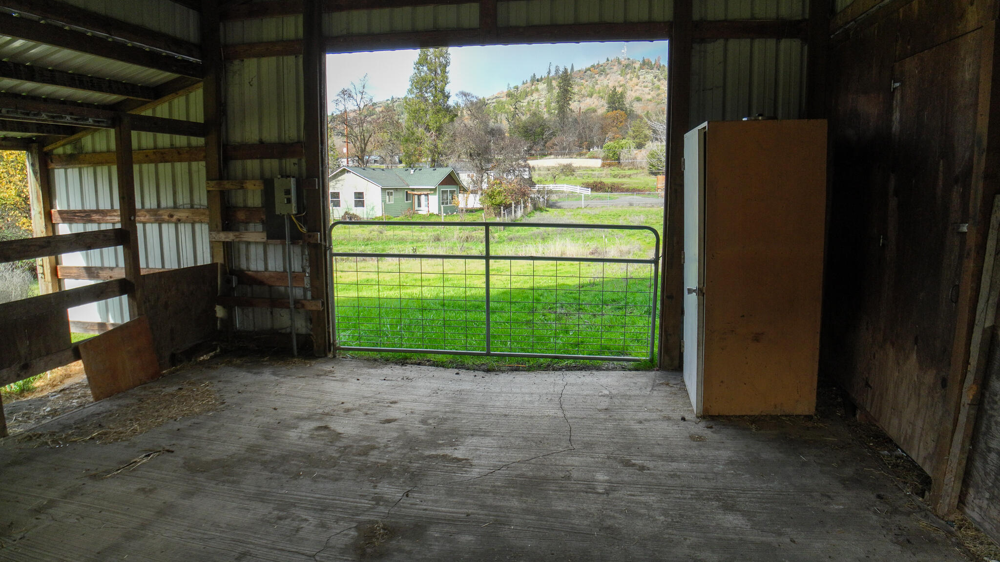 10085 Blackwell Road Central Point, OR 97502 - Photo 7 of 29 a view of a porch with a floor to ceiling window and tree