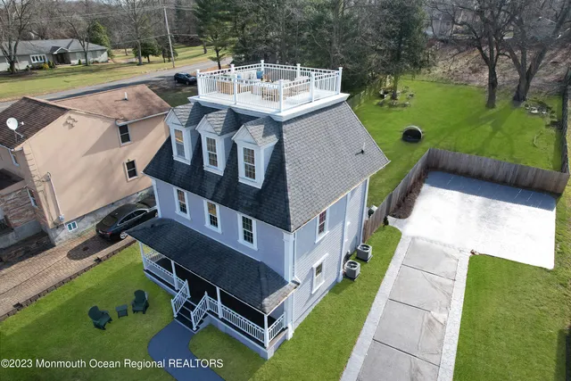 a view of a house with pool and yard