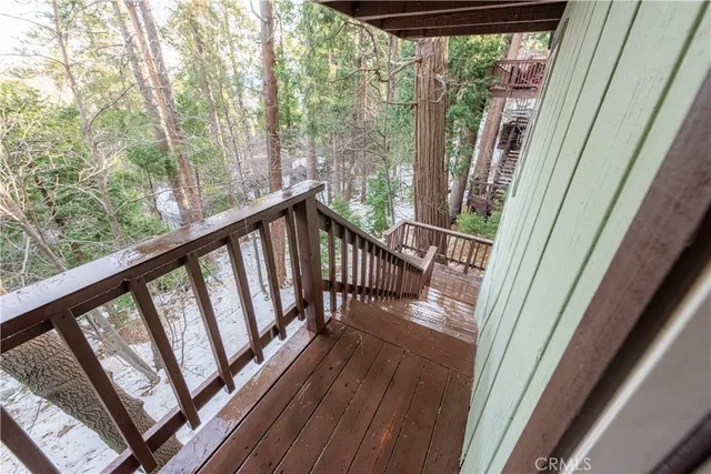 a view of balcony with wooden floor