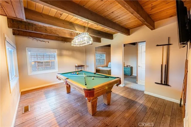 a room with furniture and wooden floor