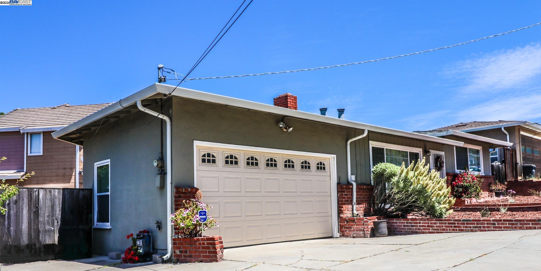 2272 Kelly Street Hayward, CA 94541 - Photo 2 of 32 a front view of a house with potted plants