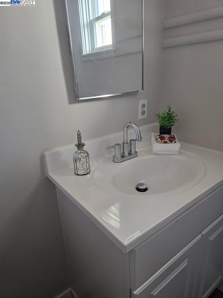 2272 Kelly Street Hayward, CA 94541 - Photo 26 of 32 a bathroom with a sink and a mirror