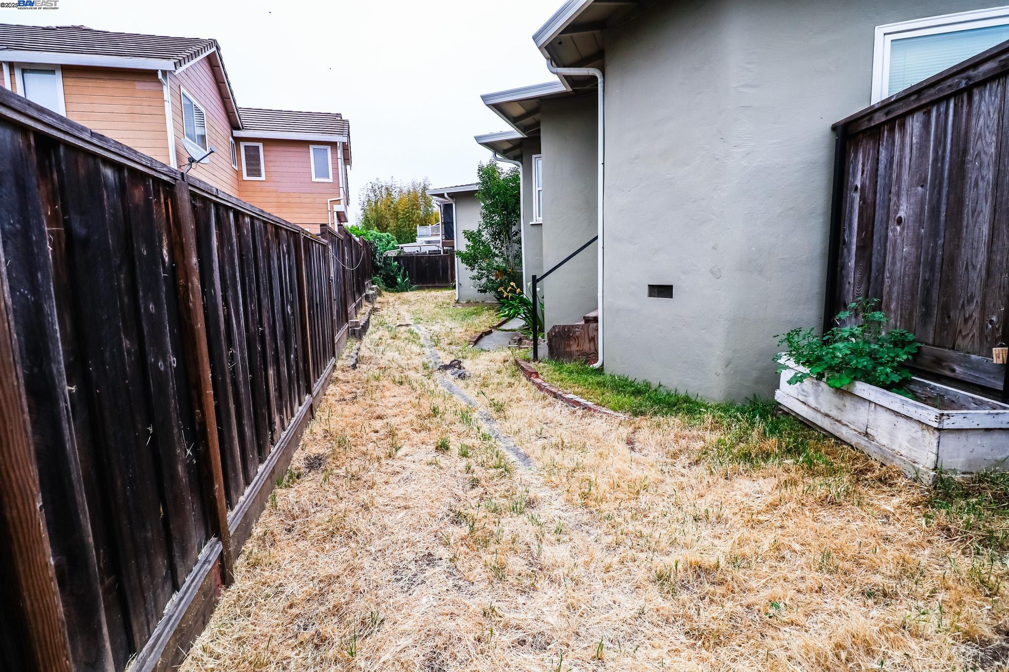 2272 Kelly Street Hayward, CA 94541 - Photo 31 of 32 a pathway of a house with wooden fence
