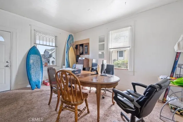 a view of a livingroom with furniture and a window