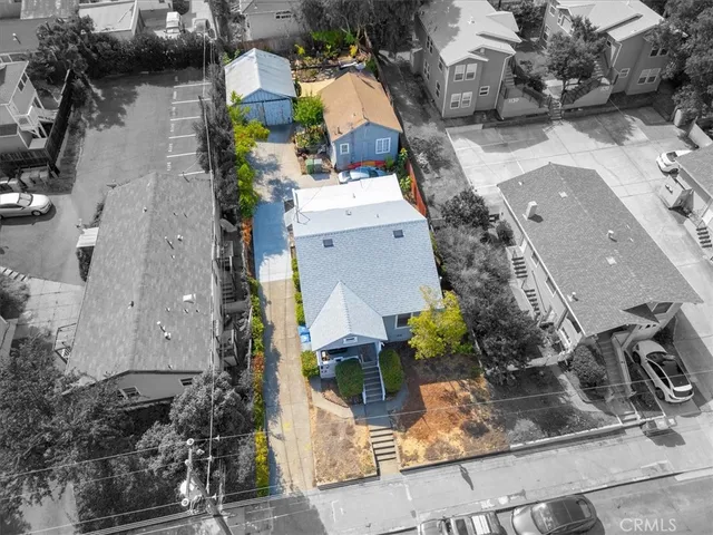 an aerial view of a house with outdoor space
