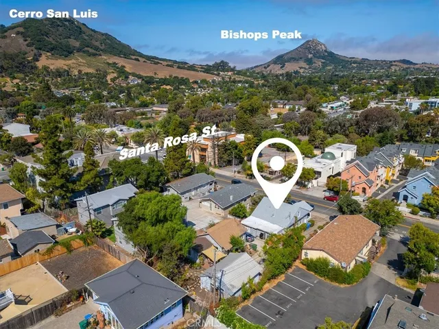 an aerial view of a house with yard swimming pool and outdoor seating