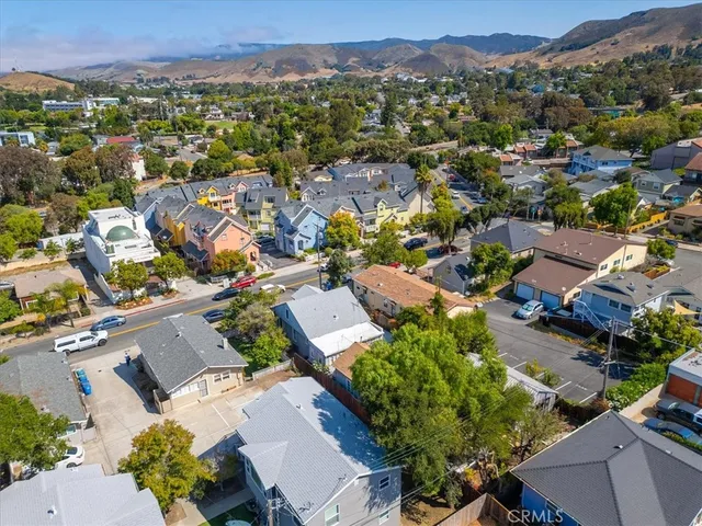 an aerial view of residential houses with outdoor space