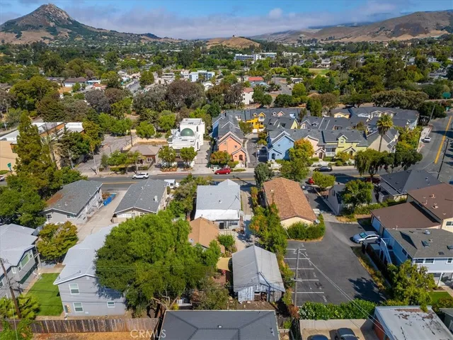 an aerial view of residential houses with outdoor space