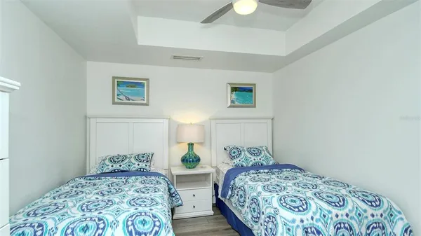 a bedroom with a bed and a lamp