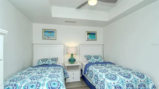 a bedroom with a bed and a lamp