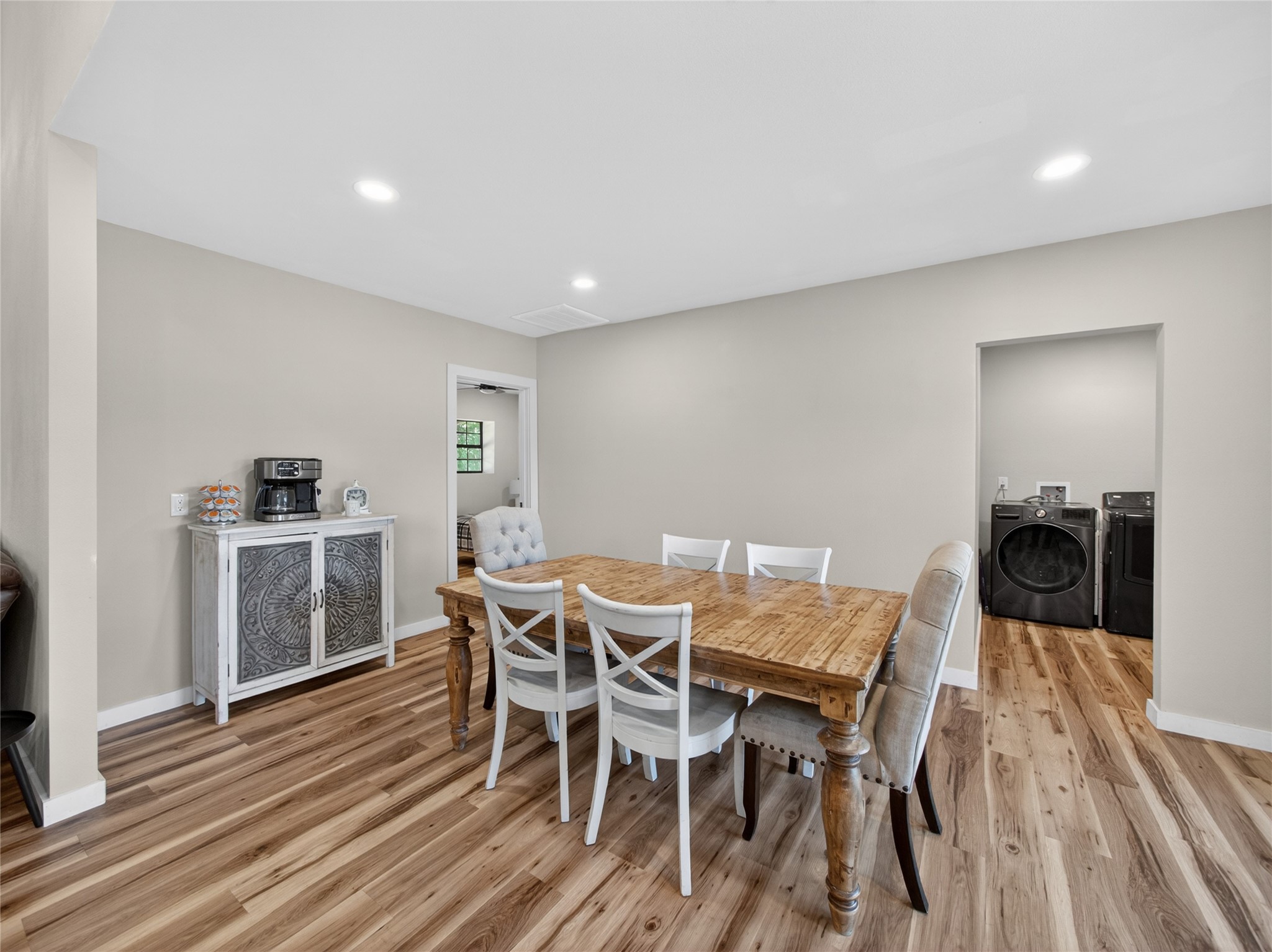 411 Avila Lane Briggs, TX 78608 - Photo 13 of 39 a view of a dining room with furniture and wooden floor