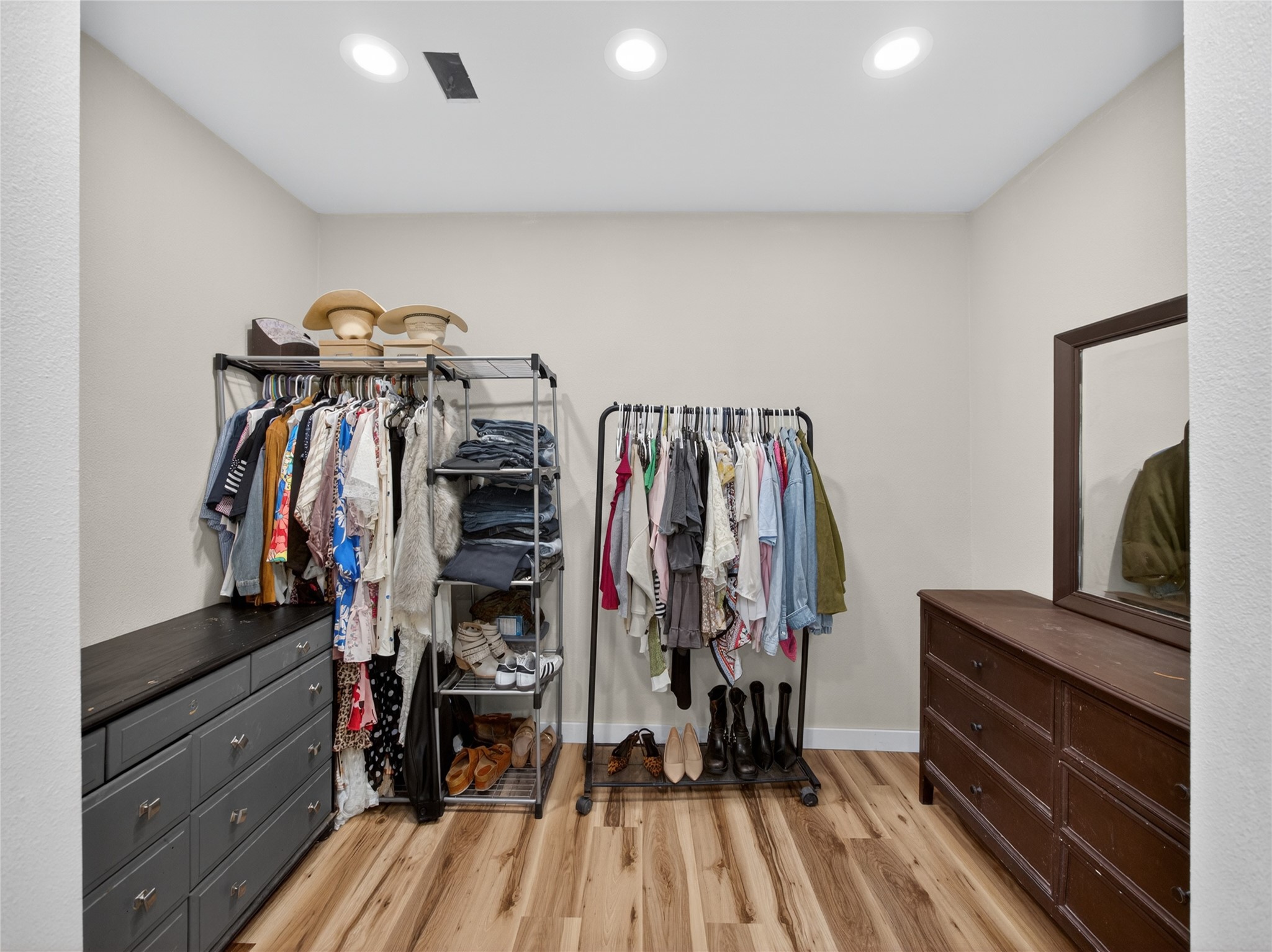 411 Avila Lane Briggs, TX 78608 - Photo 19 of 39 a view of walk in closet with clothes and shoes