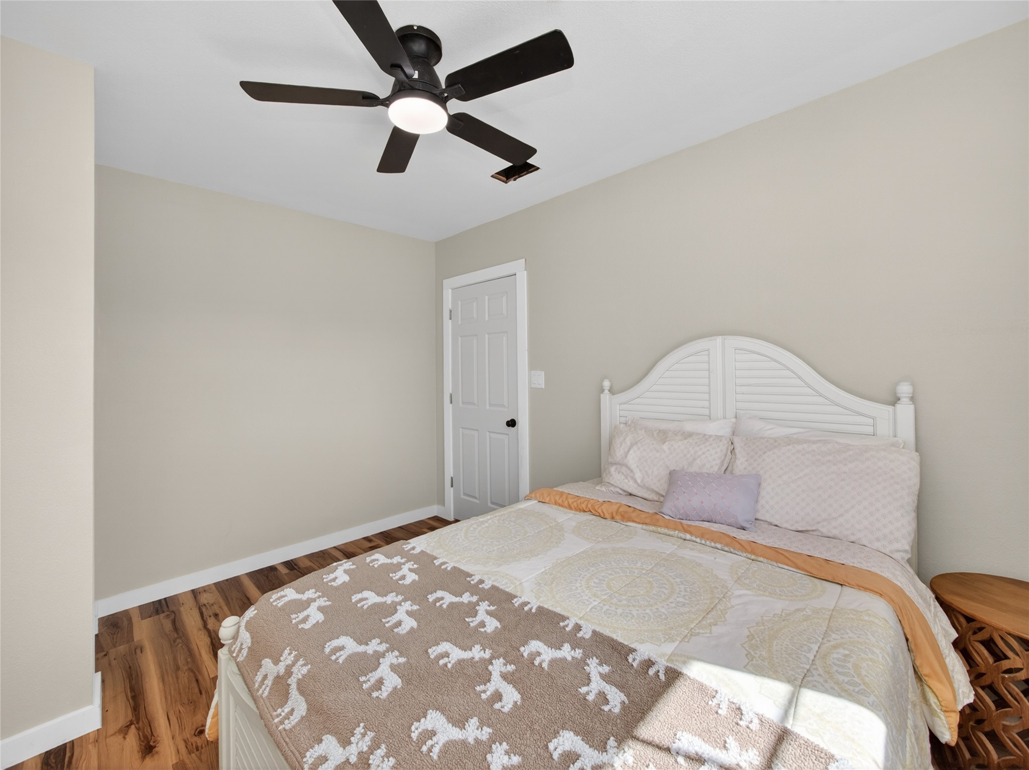 411 Avila Lane Briggs, TX 78608 - Photo 21 of 39 a bedroom with a bed and a chandelier