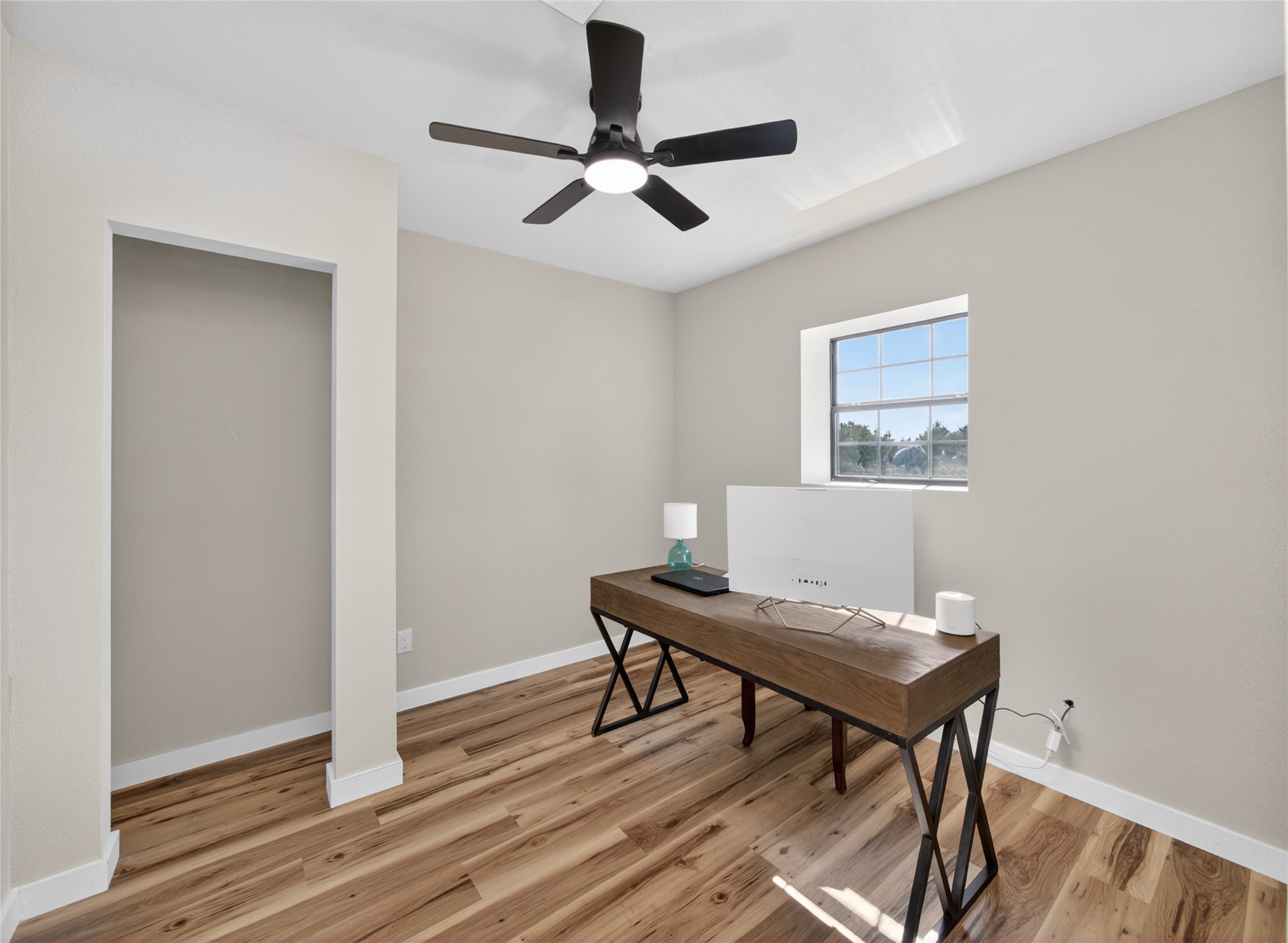 411 Avila Lane Briggs, TX 78608 - Photo 22 of 39 a workspace with furniture and wooden floor
