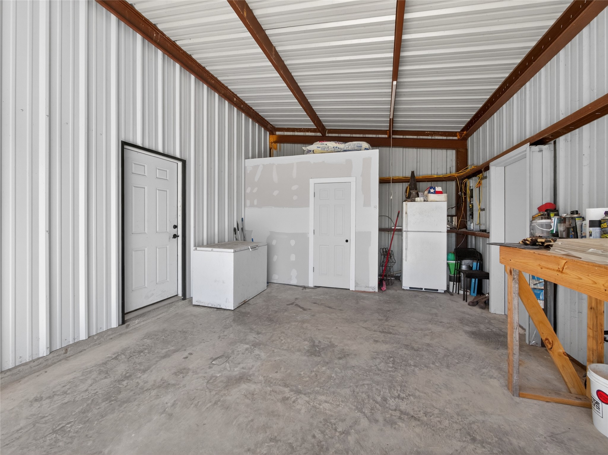 411 Avila Lane Briggs, TX 78608 - Photo 25 of 39 a view of empty room with wooden floor