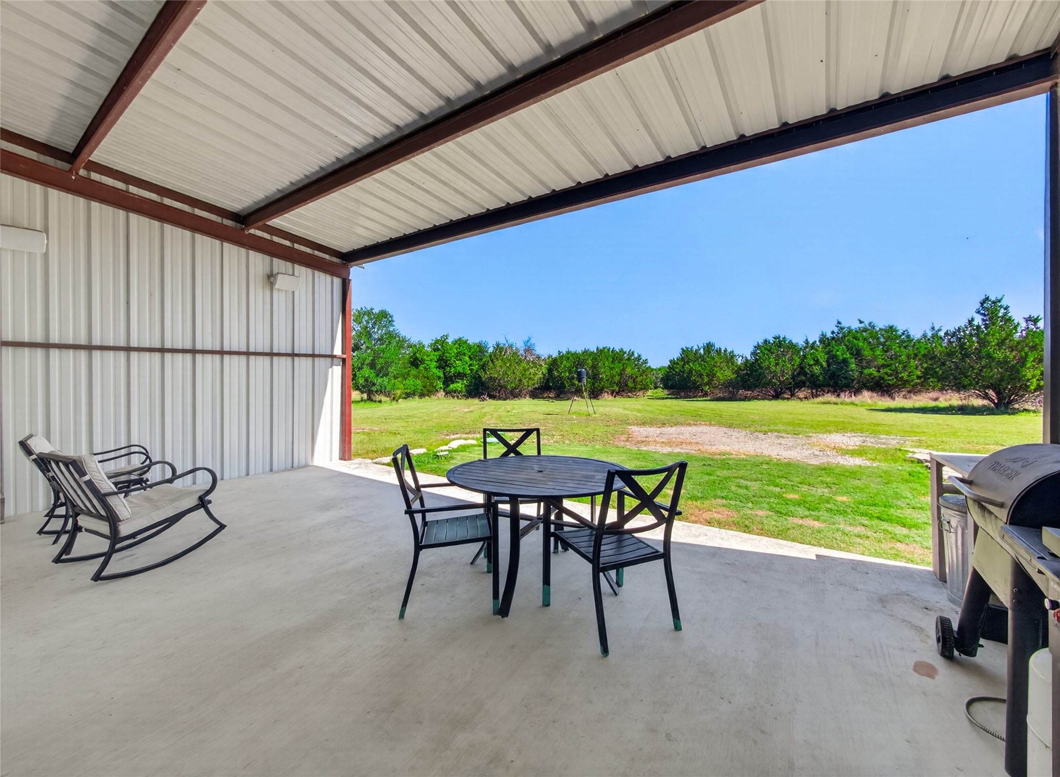 411 Avila Lane Briggs, TX 78608 - Photo 26 of 39 a patio with yard table and chairs