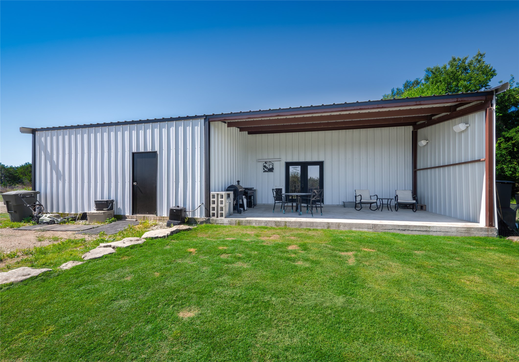 411 Avila Lane Briggs, TX 78608 - Photo 27 of 39 a view of a house with backyard and sitting area