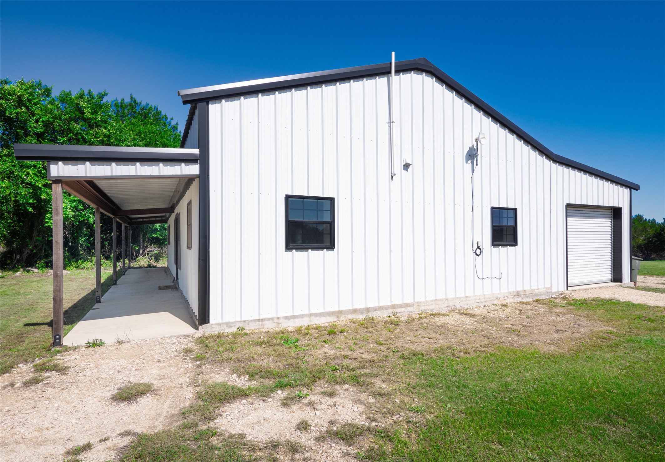 411 Avila Lane Briggs, TX 78608 - Photo 28 of 39 a view of a house with backyard and plants