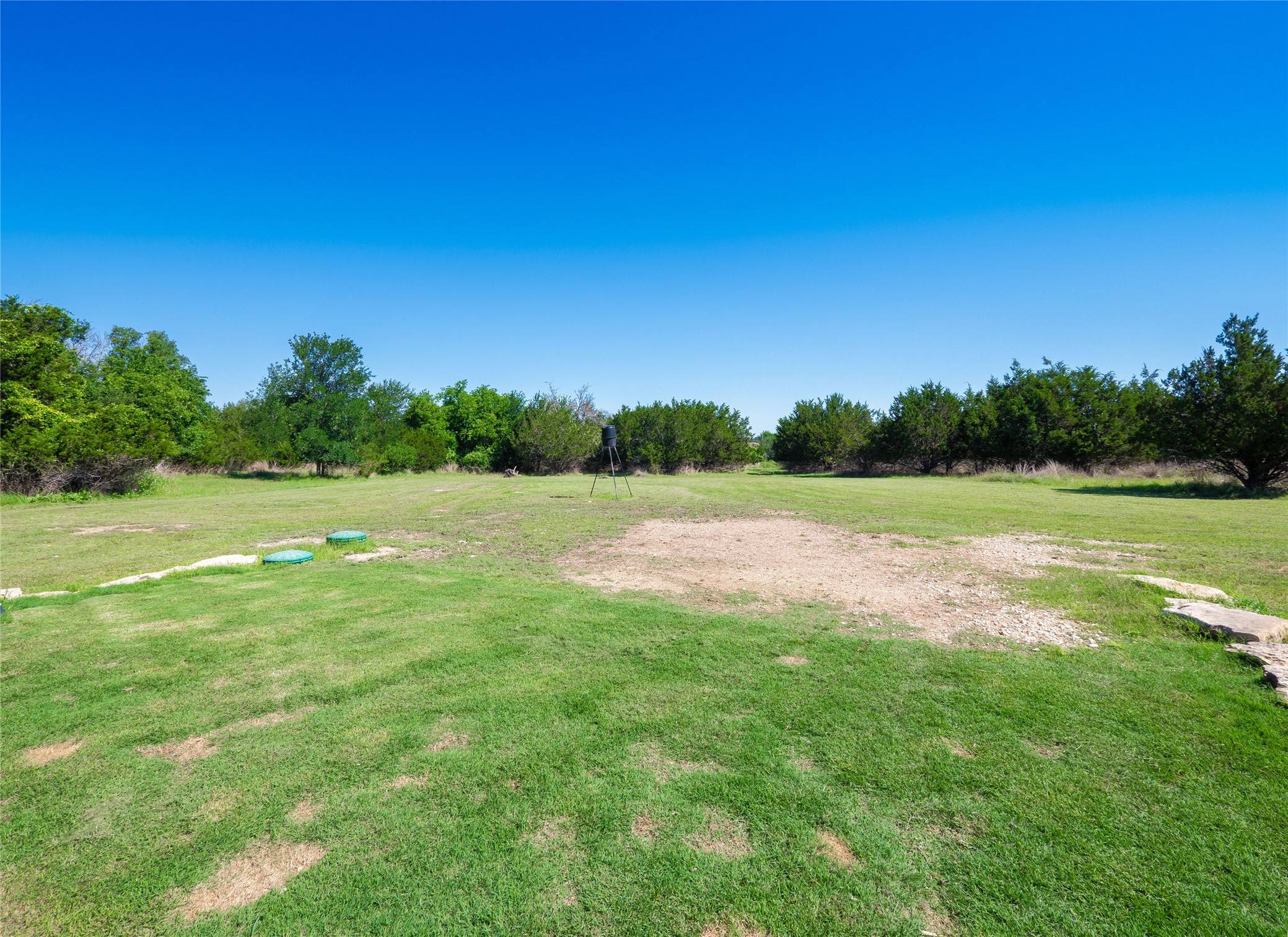 411 Avila Lane Briggs, TX 78608 - Photo 29 of 39 a view of a grassy field