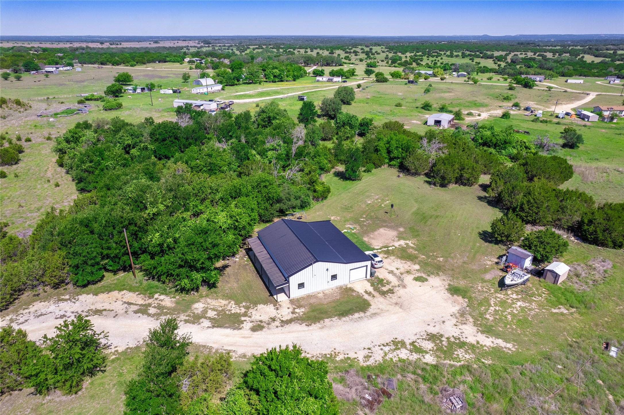 411 Avila Lane Briggs, TX 78608 - Photo 35 of 39 a view of a street with a yard