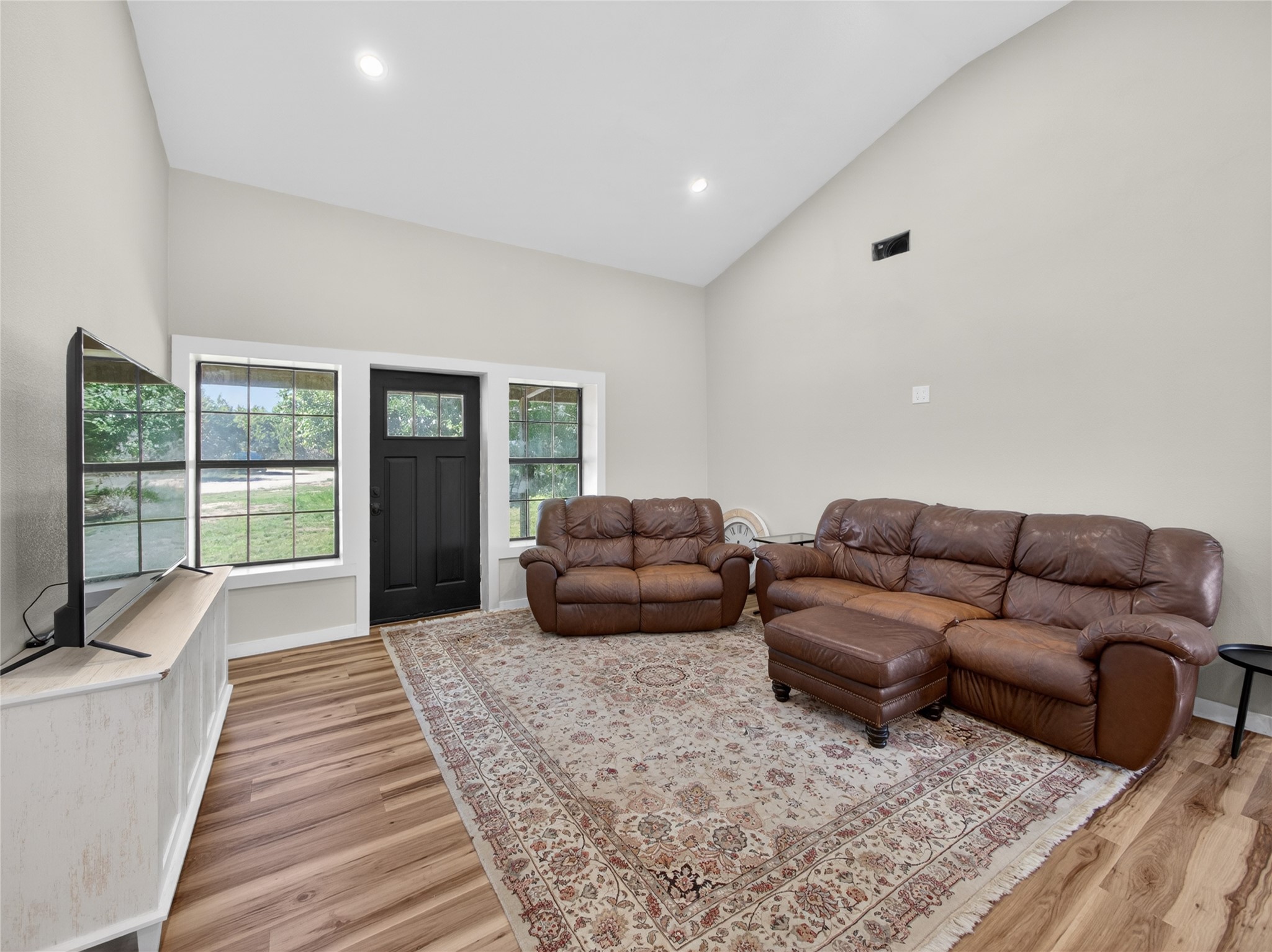 411 Avila Lane Briggs, TX 78608 - Photo 4 of 39 a living room with furniture and a large window