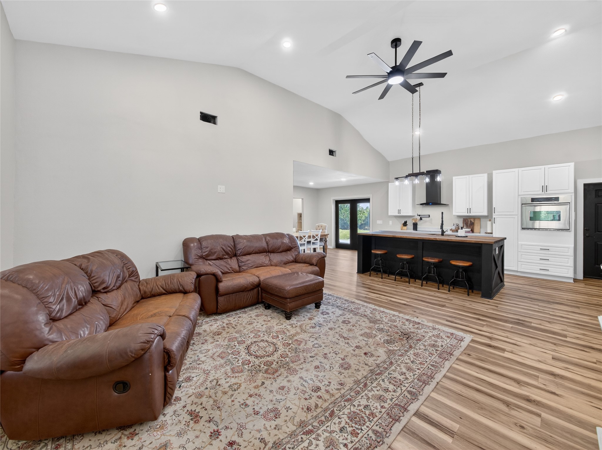 411 Avila Lane Briggs, TX 78608 - Photo 6 of 39 a living room with furniture a ceiling fan and a rug