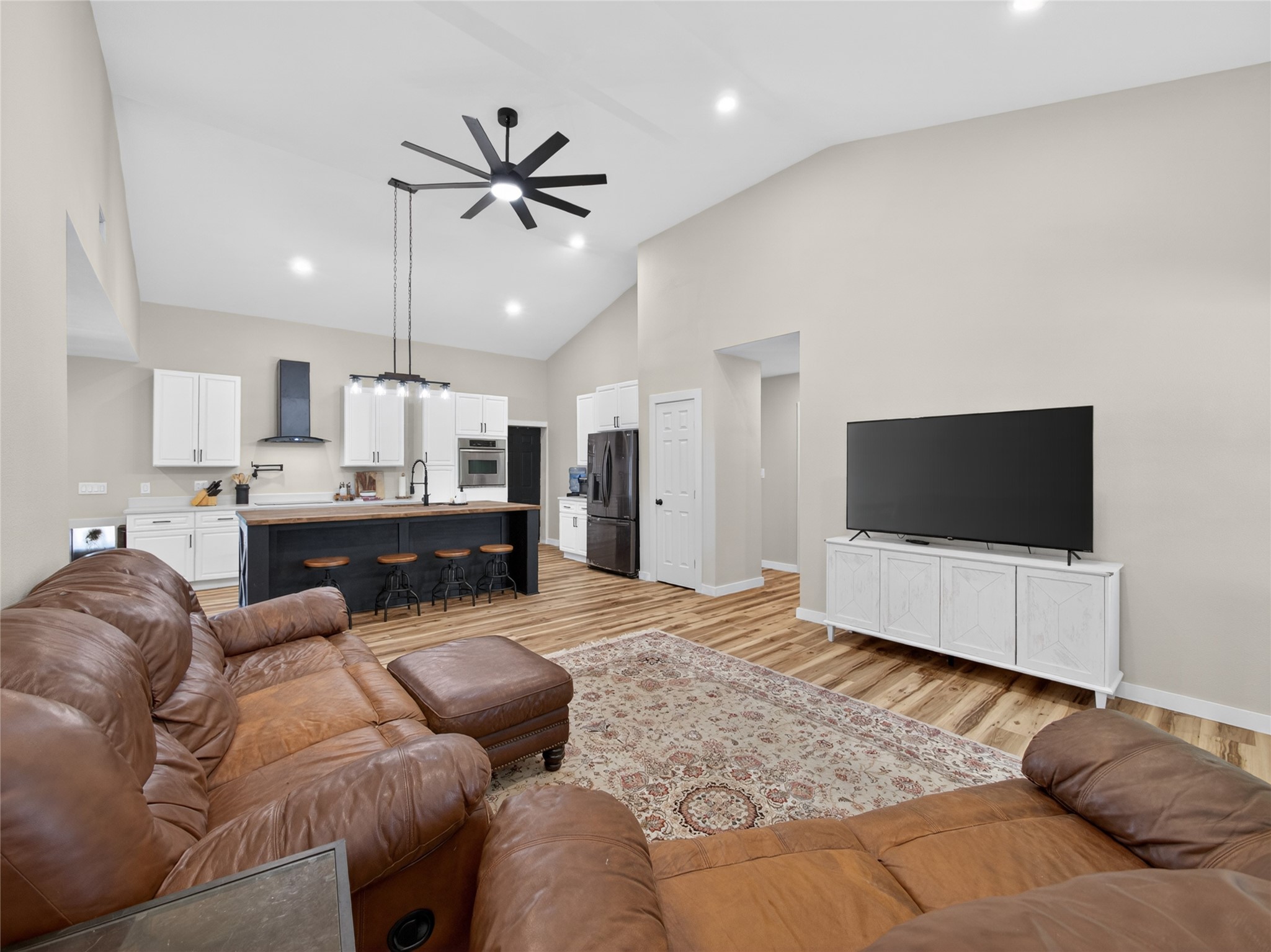 411 Avila Lane Briggs, TX 78608 - Photo 7 of 39 a living room with furniture and a flat screen tv